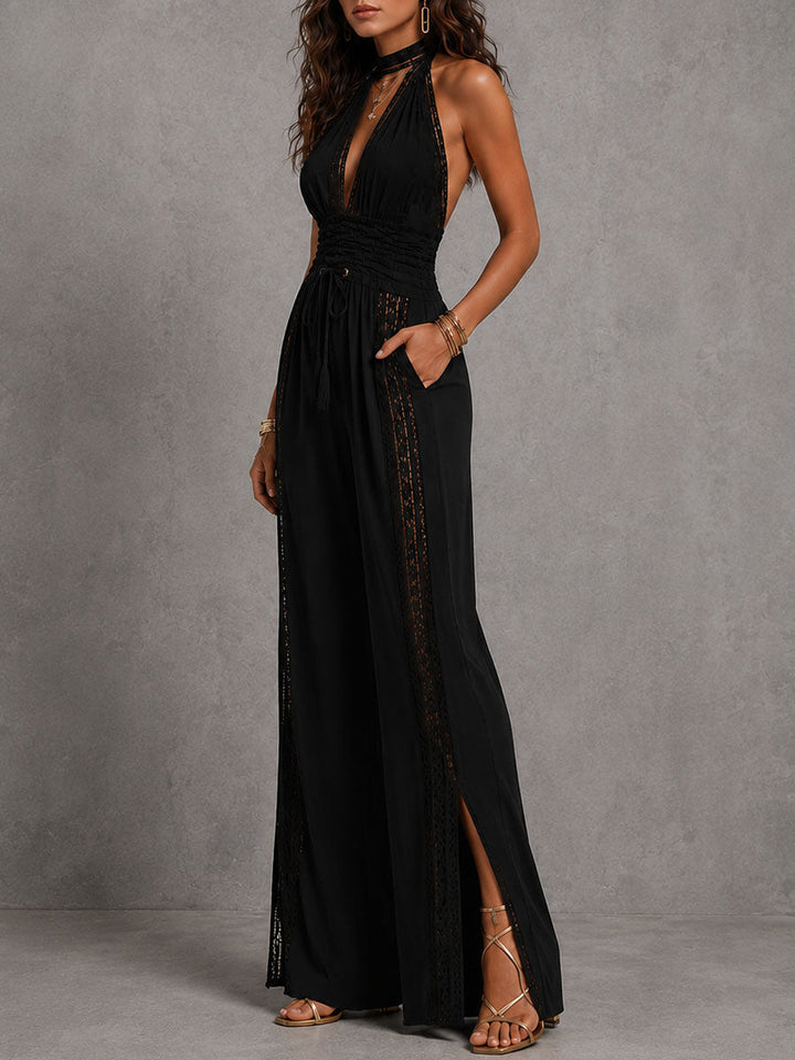Back view of the flowing wide-leg jumpsuit, showcasing the halter neckline straps.