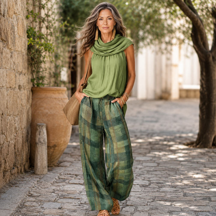 Back view of a woman standing in Solana relaxed wide-leg trousers, emphasizing the comfortable and elegant drape.