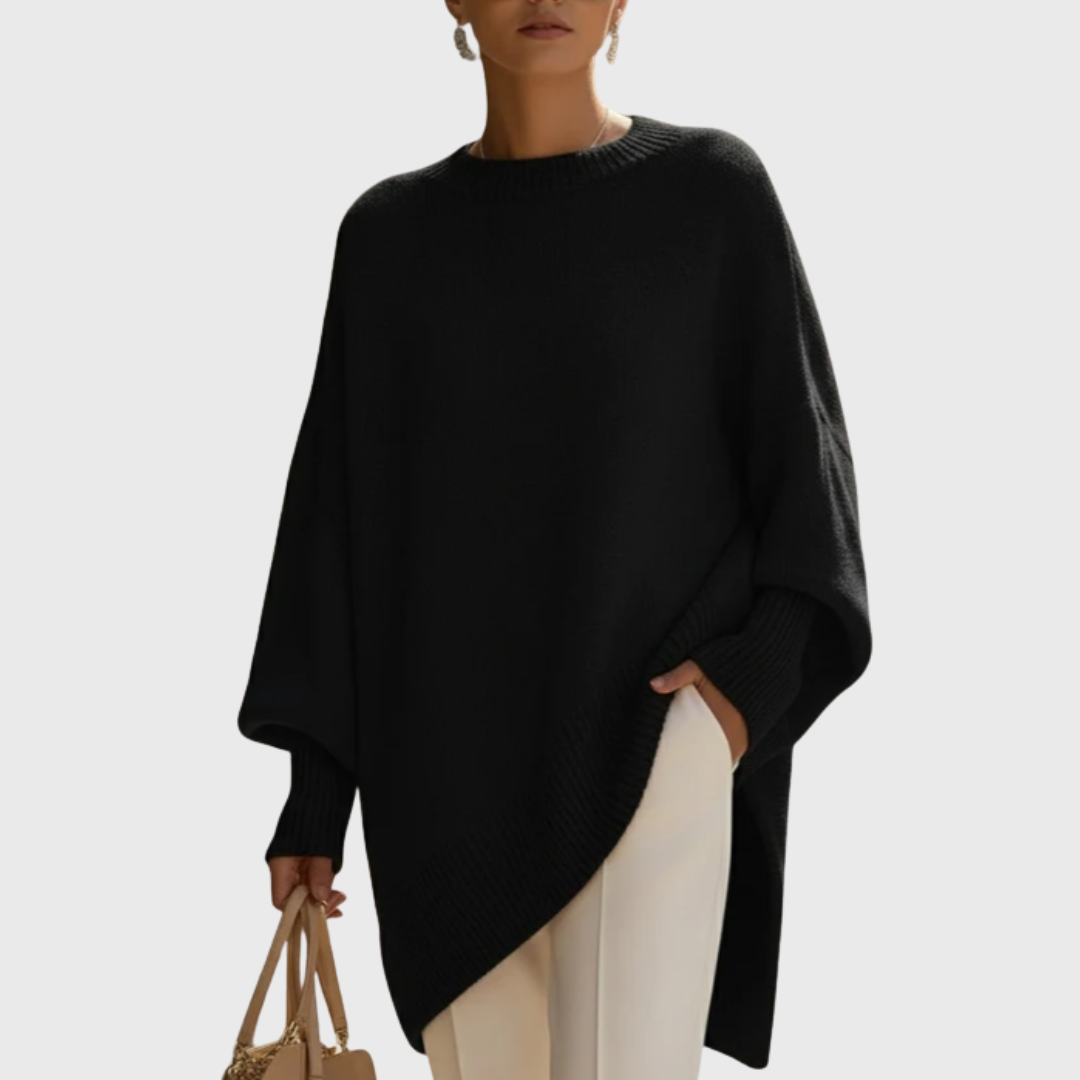 Folded Solana poncho pullover in olive, showcasing its compact and travel-friendly nature.