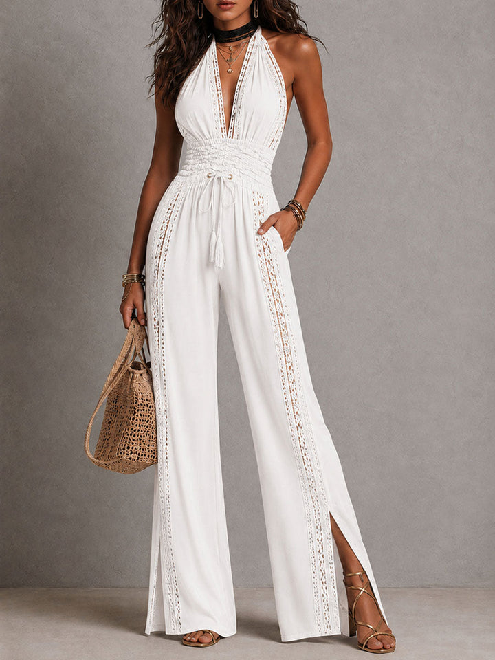 A woman walking in the elegant halter jumpsuit, illustrating its comfortable movement.