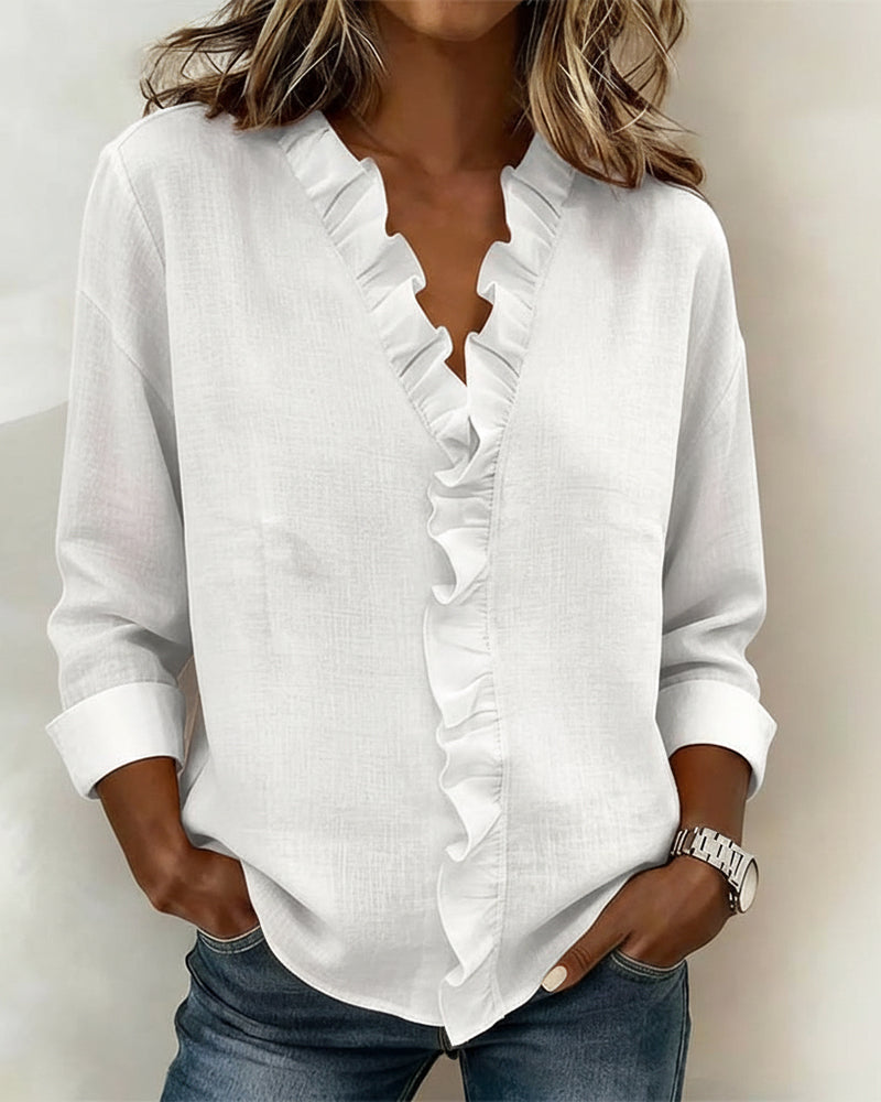 Back view of a green ruffle V-neck long-sleeve blouse, showing its relaxed regular fit and drape.