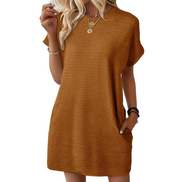 Lifestyle shot of a woman in a dark brown Valerie casual round neck dress, enjoying a relaxed outdoor moment.