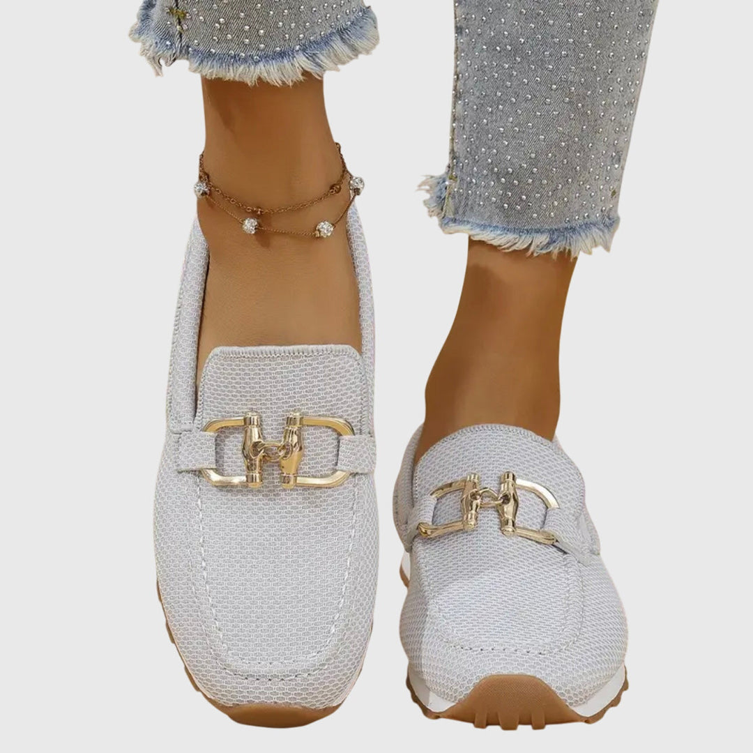 Side profile view of the blue orthopedic loafer sneakers, showcasing the subtle heel and sole design.