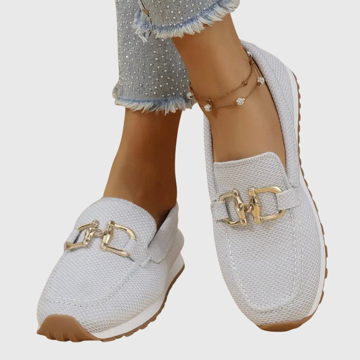 Front view of the beige orthopedic loafer sneakers, displaying the classic loafer silhouette with modern details.