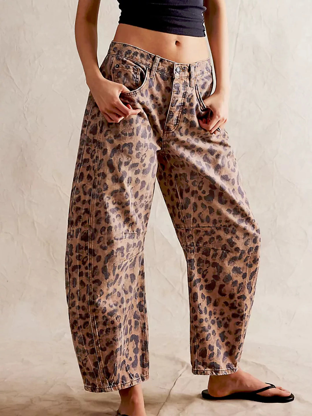 Full front view of Zephyrine leopard print barrel jeans on a mannequin, showcasing the wide leg and mid-rise.