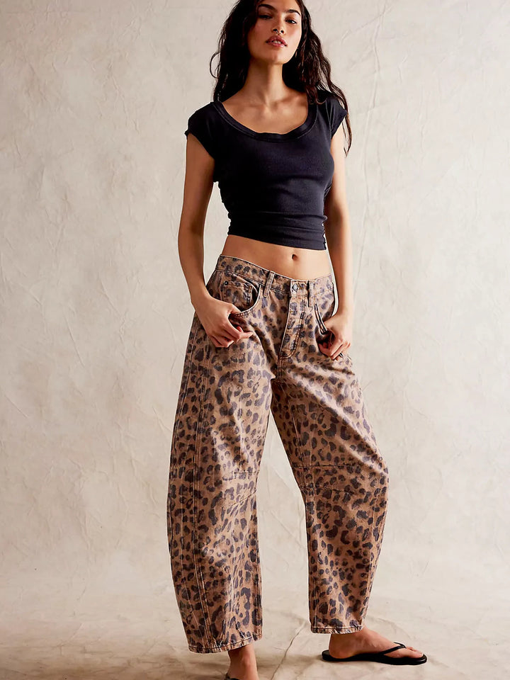 Flat lay of the Zephyrine leopard print barrel jeans, neatly folded to show the full pattern.