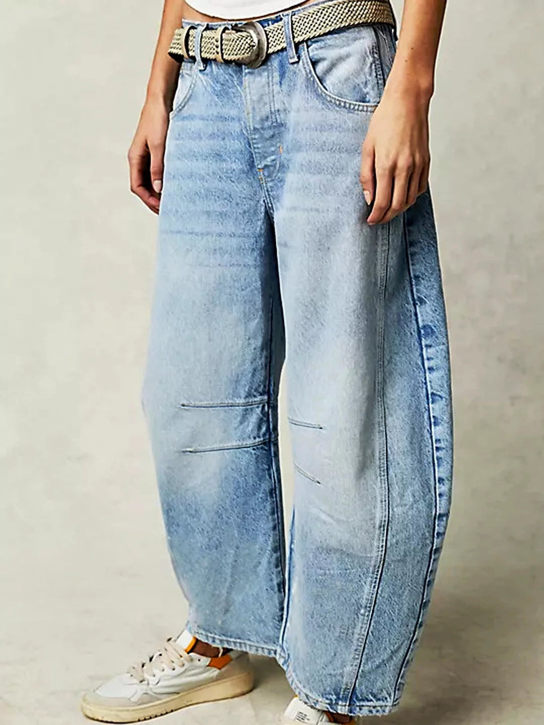 Rear view of the Zephyrine leopard print barrel jeans, detailing the back pockets and overall silhouette.